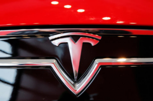 A Tesla logo on a Model S is photographed inside of a Tesla dealership in New York, U.S., April 29, 2016.